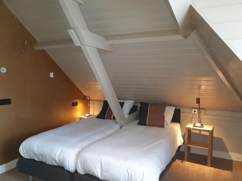 Postel nebo postele na pokoji v ubytování Hotel Montfoort