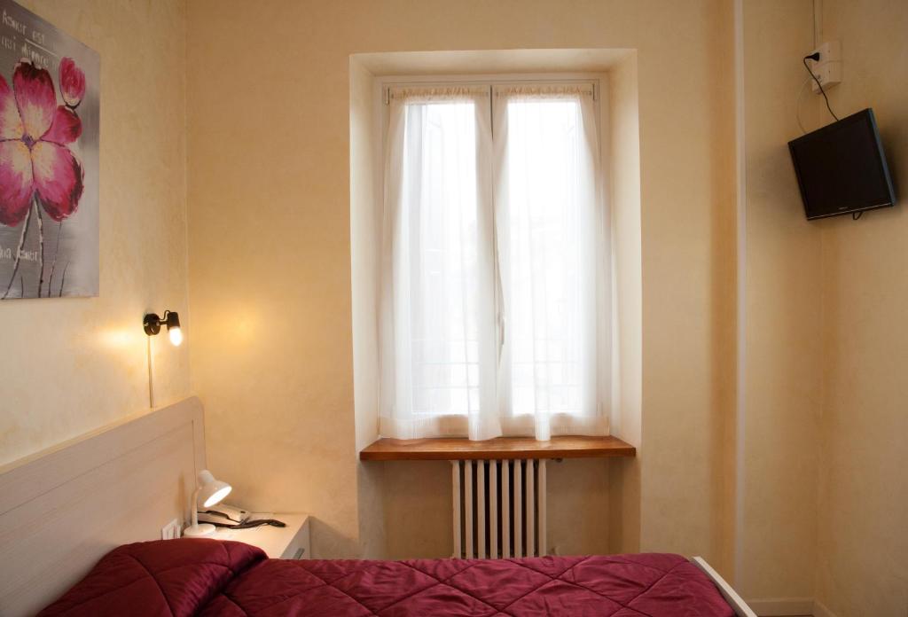 TV a/nebo společenská místnost v ubytování Antico Albergo