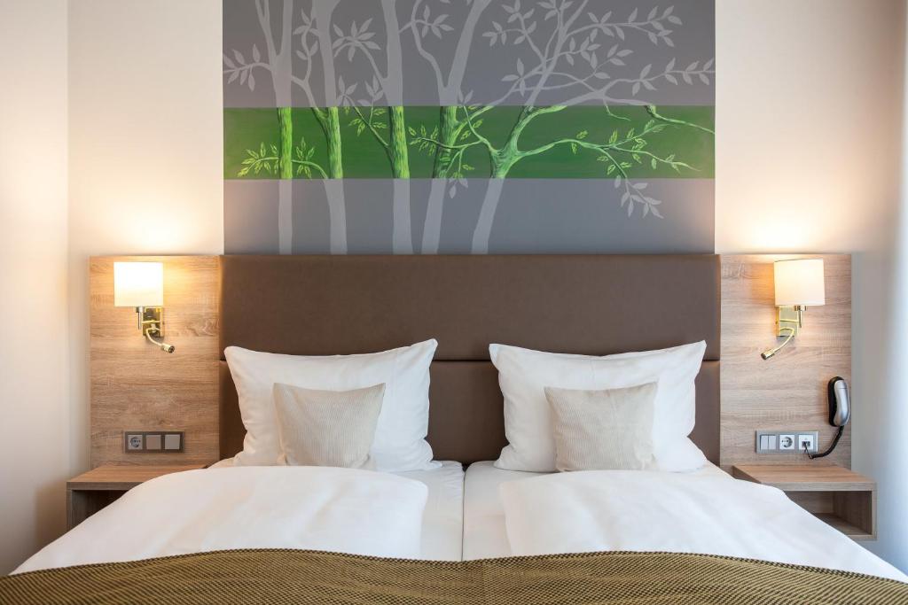 Postel nebo postele na pokoji v ubytování Stay! Hotel Boardinghouse