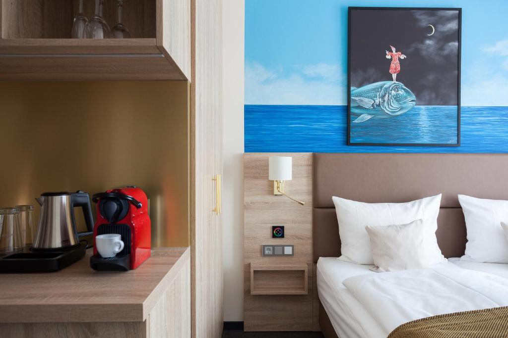 Postel nebo postele na pokoji v ubytování Stay! Hotel Boardinghouse