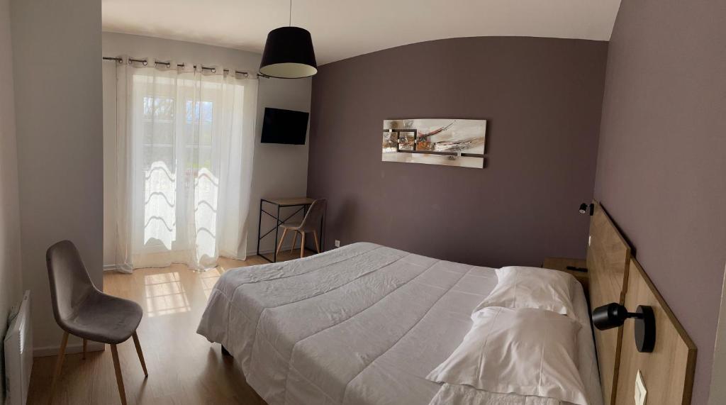 Postel nebo postele na pokoji v ubytování Hotel Mendy
