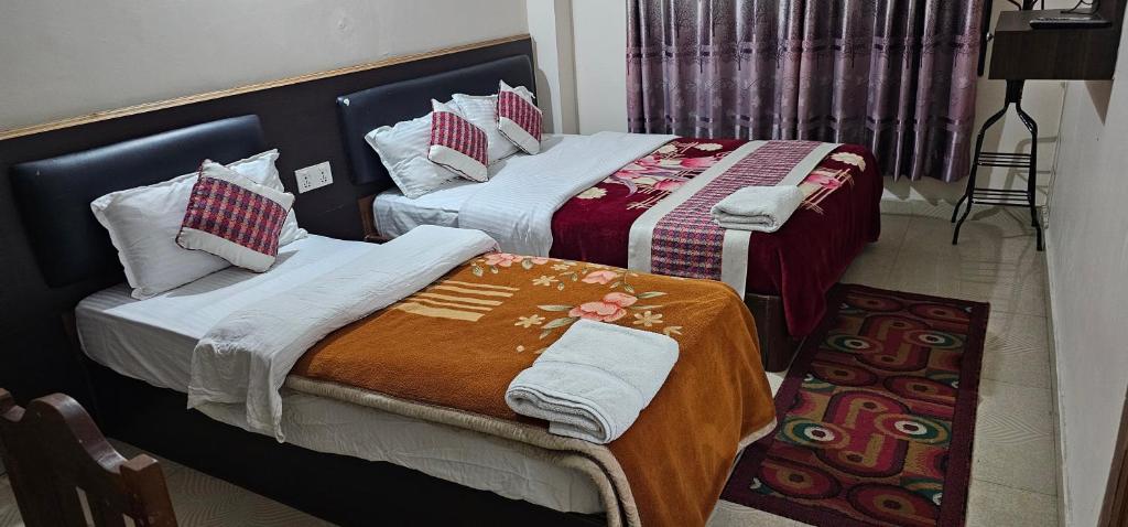 Rúm í herbergi á Hotel Simara