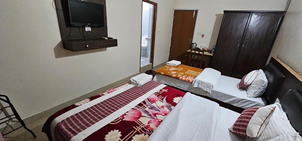 Rúm í herbergi á Hotel Simara