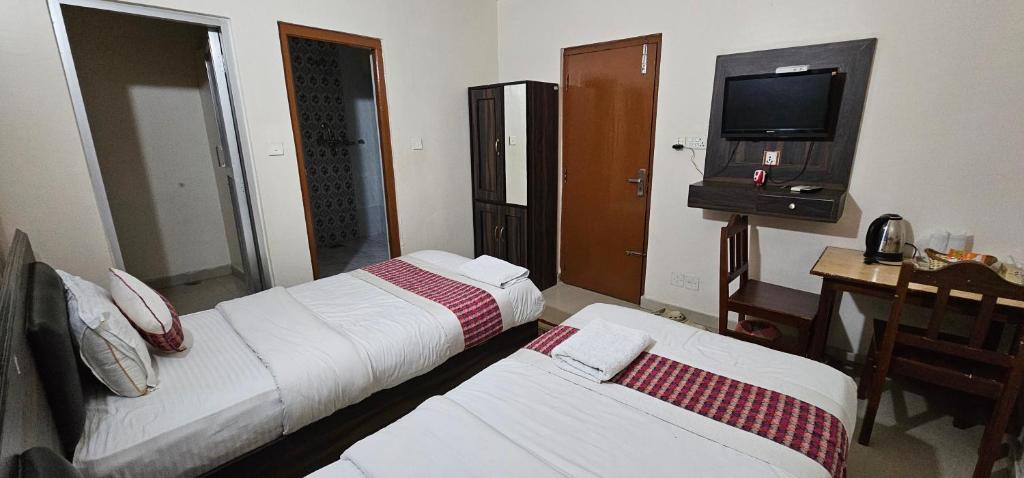 Rúm í herbergi á Hotel Simara