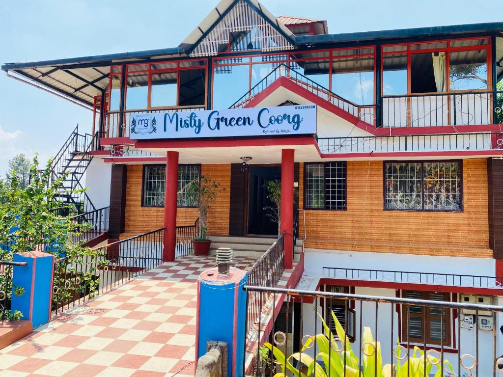 a building with a sign that reads mystery green curry at Misty Green Coorg in Madikeri