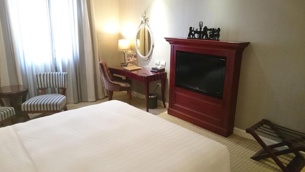 Postel nebo postele na pokoji v ubytování MRT Hotel