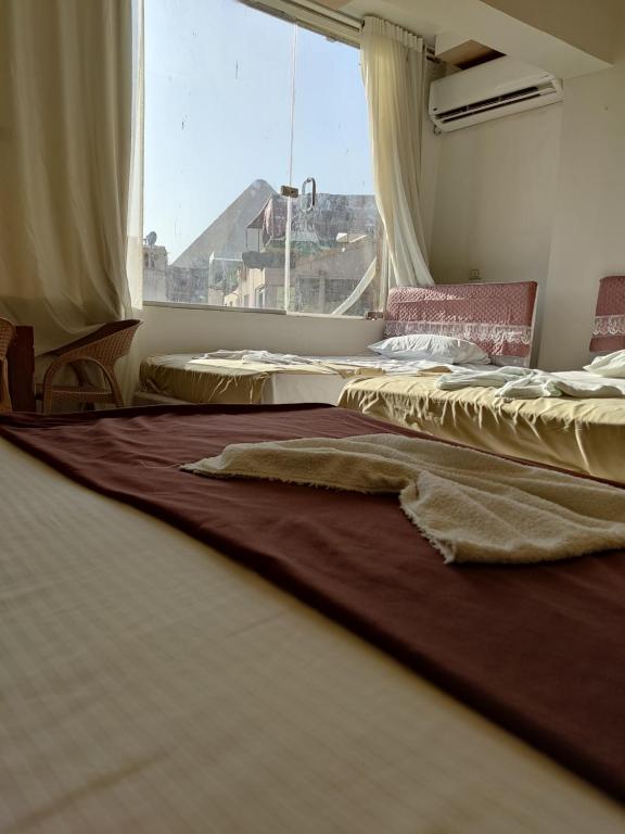 Fotografie z fotogalerie ubytování dream pyramids view v Káhiře