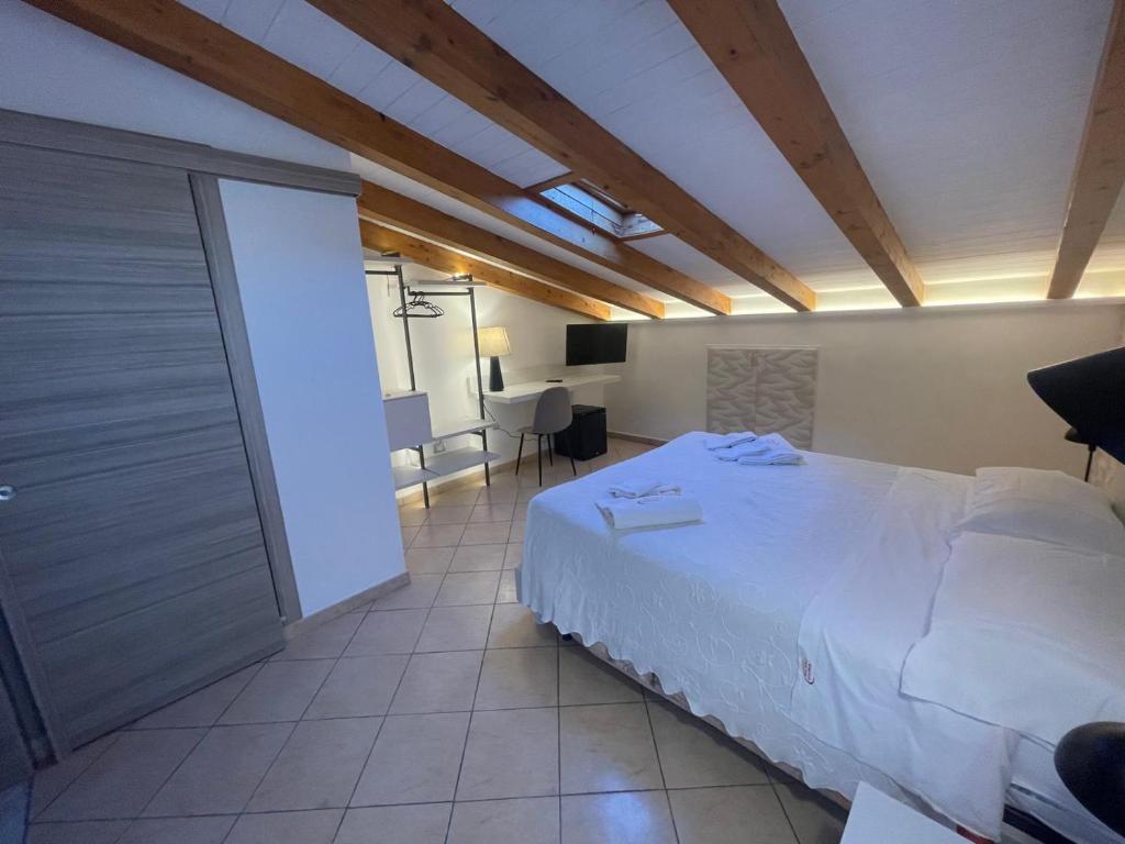 Postel nebo postele na pokoji v ubytování Albergo Perseo