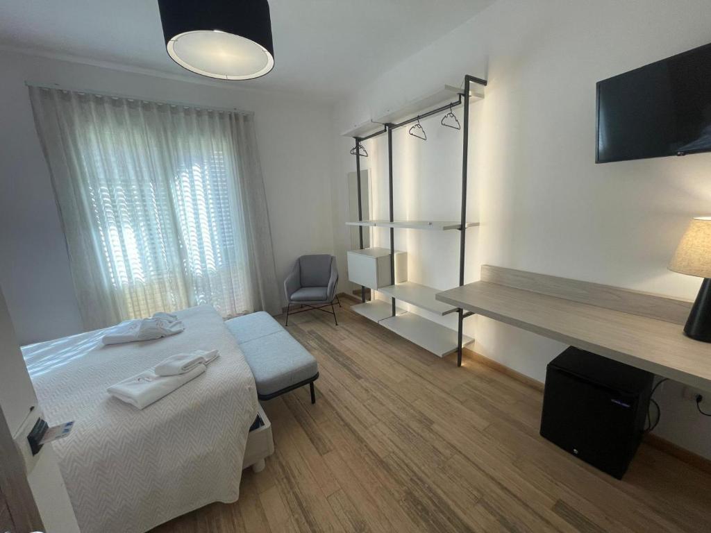 Postel nebo postele na pokoji v ubytování Albergo Perseo