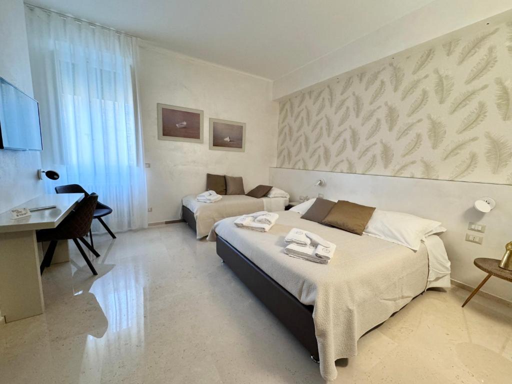 Postel nebo postele na pokoji v ubytování Bebio Rooms