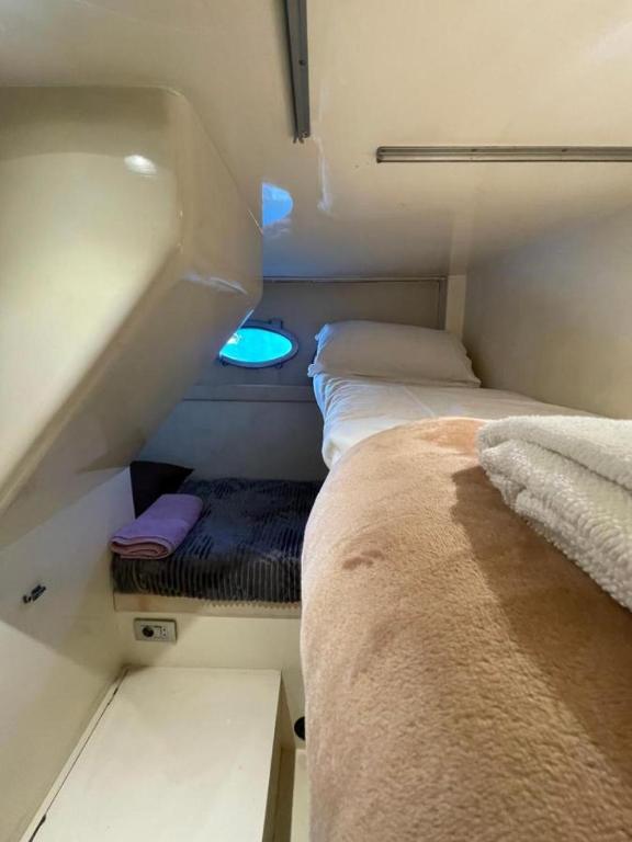 Postel nebo postele na pokoji v ubytování Yate Hotel STV
