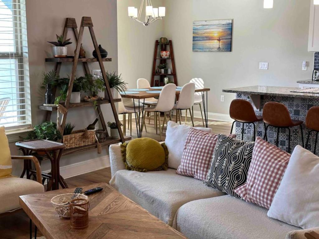 a living room with a couch and a table at Florida House Rental - 2 Miles to Navarre Beach in Navarre