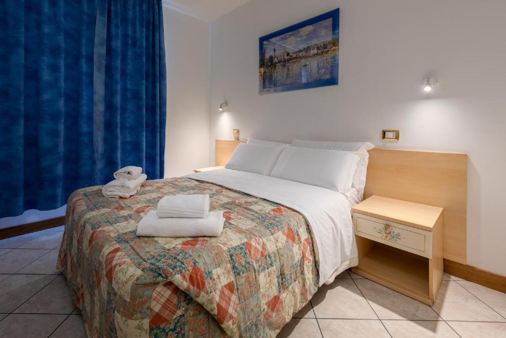 Posteľ alebo postele v izbe v ubytovaní Hotel New Aurora Venice