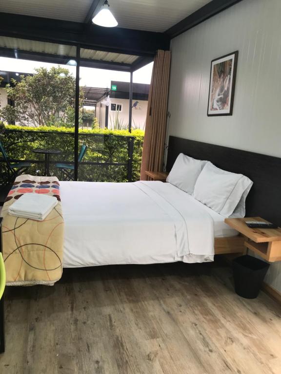 Postel nebo postele na pokoji v ubytování Hotel & Golf Isak Aeropuerto