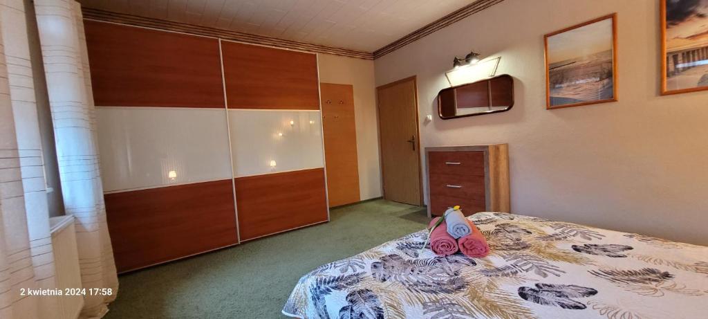 Postel nebo postele na pokoji v ubytování PROMYK - Apartamenty & Pokoje - dla dorosłych