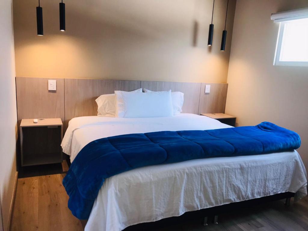 Postel nebo postele na pokoji v ubytování Hotel & Golf Isak Aeropuerto
