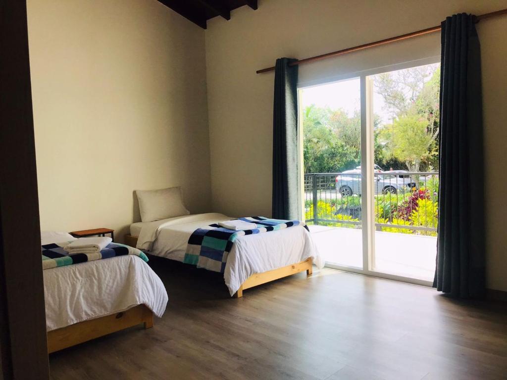 Postel nebo postele na pokoji v ubytování Hotel & Golf Isak Aeropuerto