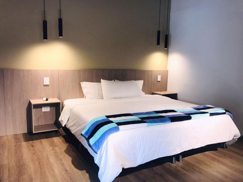 Postel nebo postele na pokoji v ubytování Hotel & Golf Isak Aeropuerto