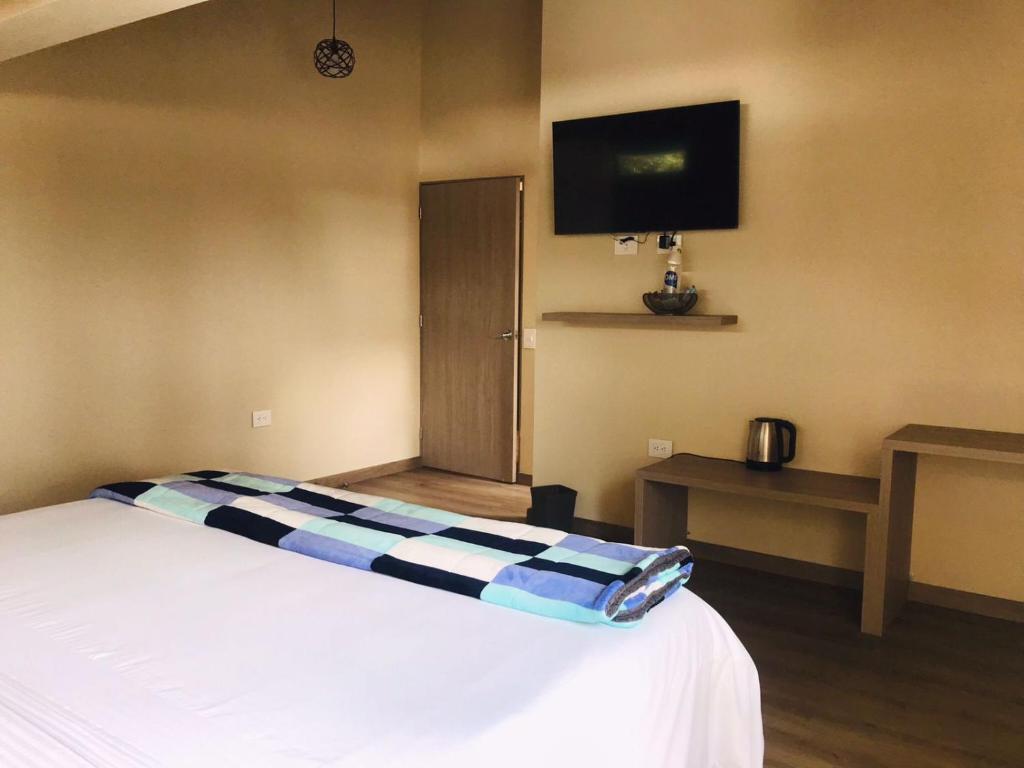 Postel nebo postele na pokoji v ubytování Hotel & Golf Isak Aeropuerto
