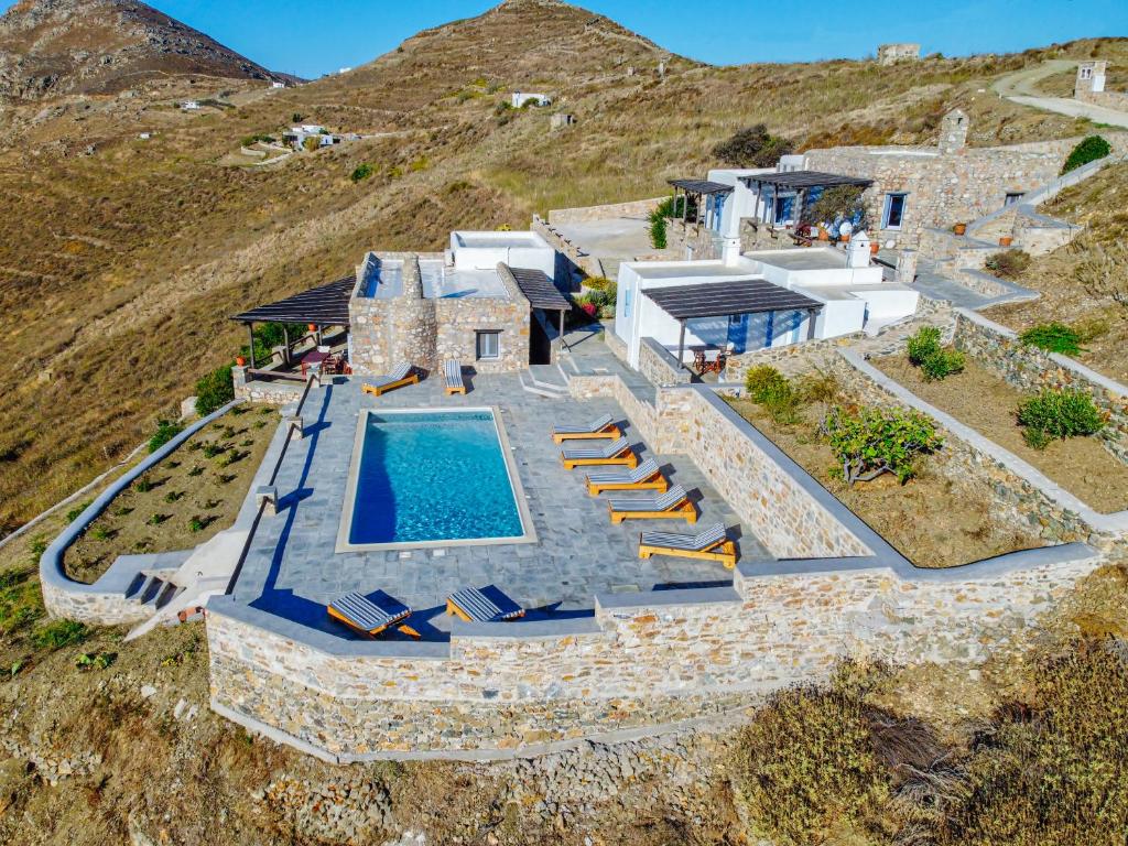 an aerial view of a house with a swimming pool at La Casa del Pastore in Serifos Chora