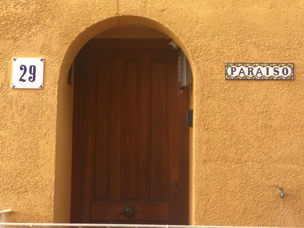 a door to a building with a sign on it at Paraíso in Cumbre del Sol