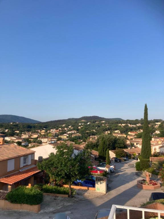 arial view of a small town with houses and a street at MAZET RÉNOVE Golfe de st TROPEZ in Cogolin