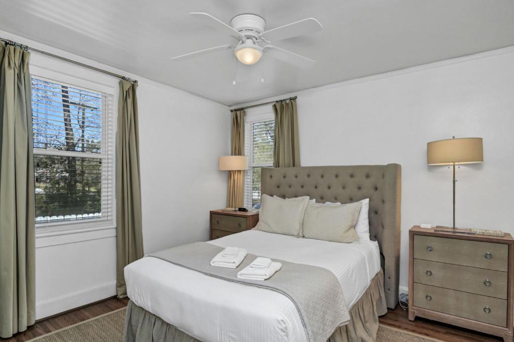 a bedroom with a bed and a ceiling fan at Modern Gem in Columbia in Columbia