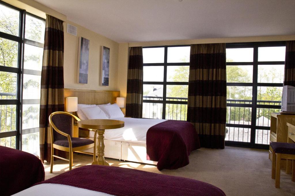 Postel nebo postele na pokoji v ubytování Upton Court Hotel