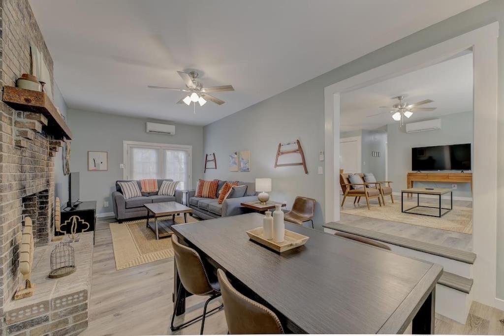 a living room with a table and a couch at Ft. Jackson Family Abode in Columbia