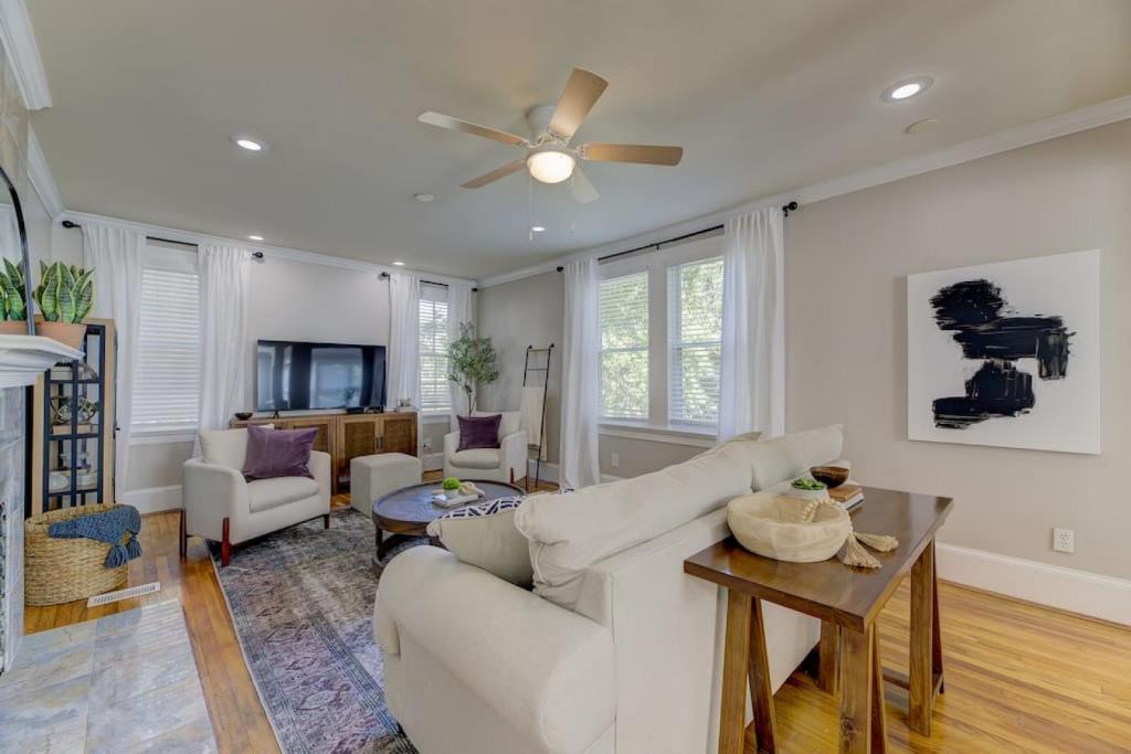 a living room with a couch and a ceiling fan at 910 Sunset - Suite on Sunset in Columbia