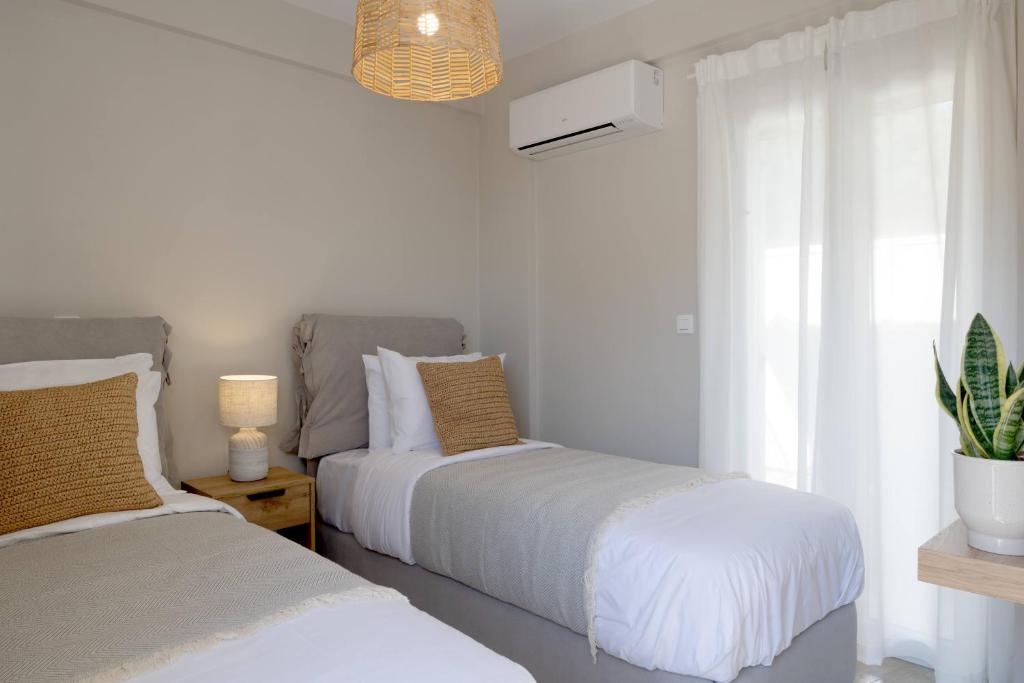 Postel nebo postele na pokoji v ubytování Paradise Villas