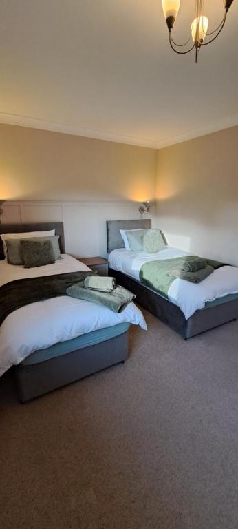 Llit o llits en una habitació de St Albans Apartment