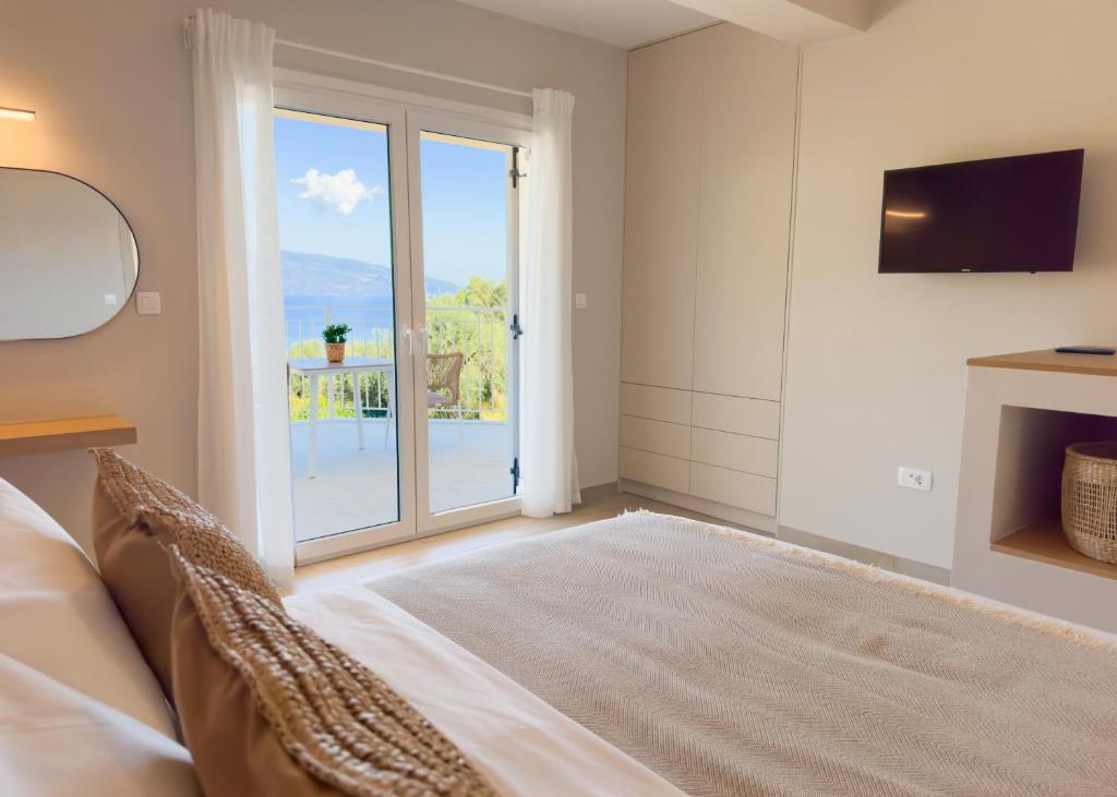 Postel nebo postele na pokoji v ubytování Paradise Villas