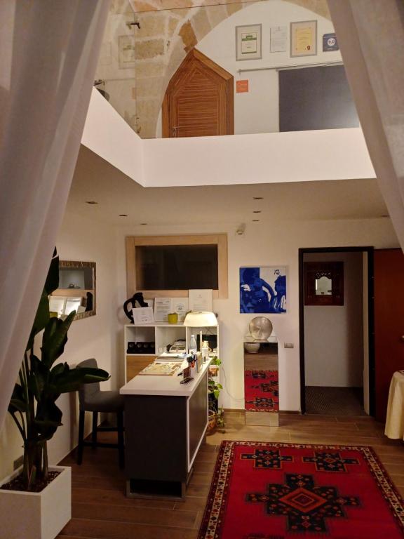 Televízia a/alebo spoločenská miestnosť v ubytovaní Bed & Breakfast Idomeneo 63