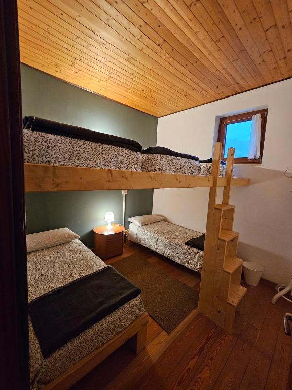 Postel nebo postele na pokoji v ubytování Rifugio Guglielmo e Giovanni Pelizzo