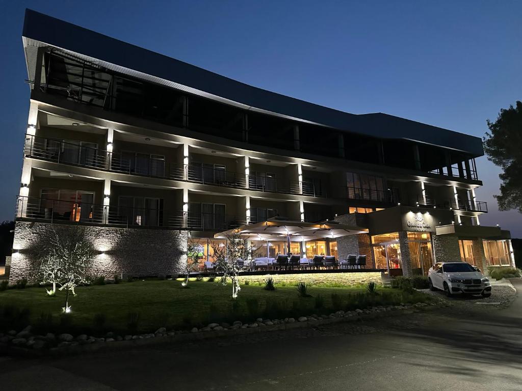 a building with a car parked in front of it at GRANDE CASA Hotel - Međugorje in Međugorje