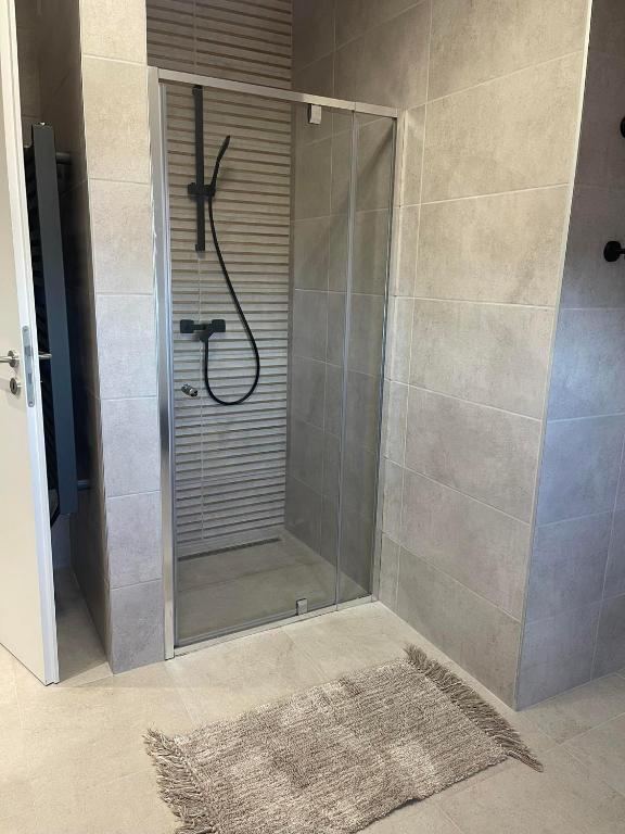 Koupelna v ubytování Hotello Apartmanház és Panzió