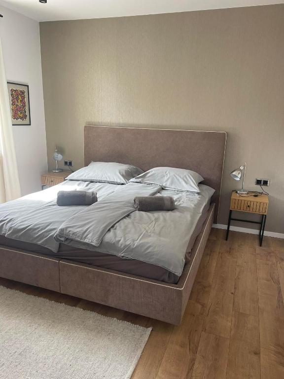 Postel nebo postele na pokoji v ubytování Hotello Apartmanház és Panzió