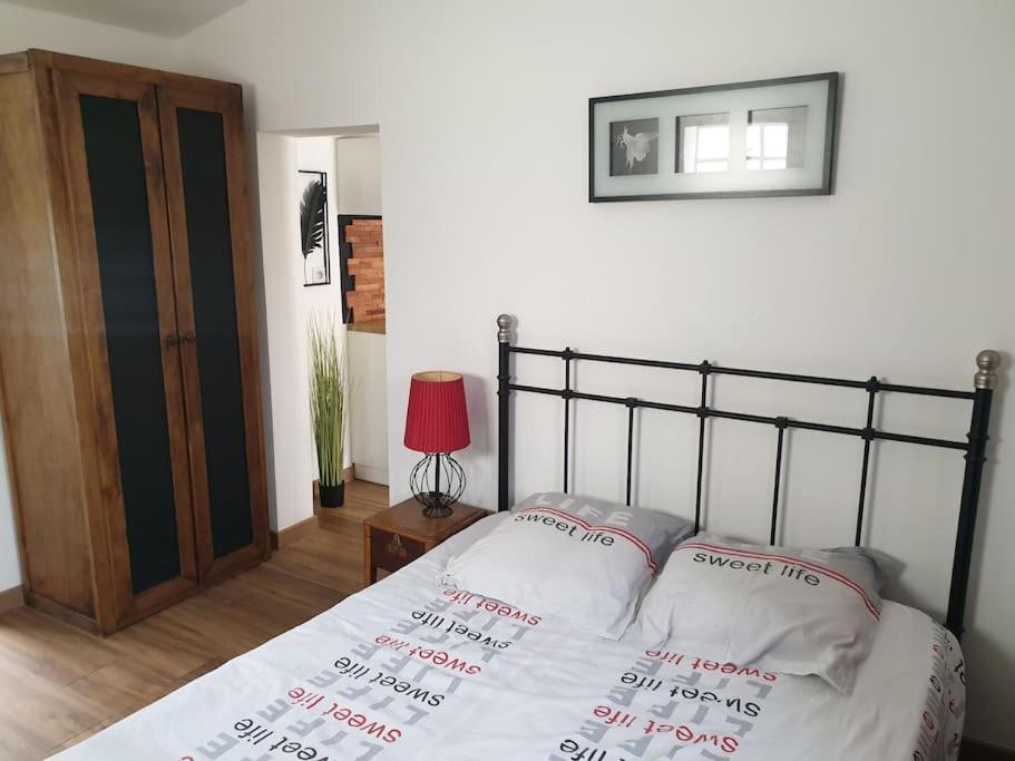 Postel nebo postele na pokoji v ubytování L'appel de la forêt