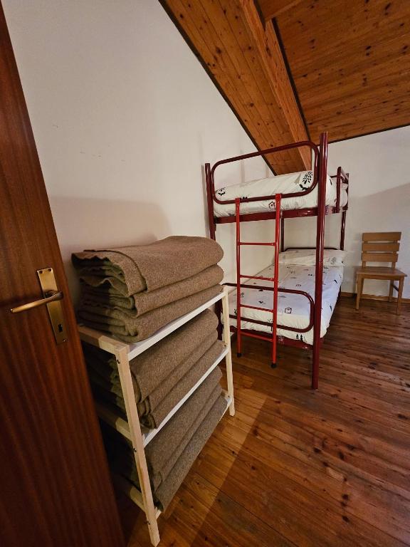 Postel nebo postele na pokoji v ubytování Rifugio Guglielmo e Giovanni Pelizzo
