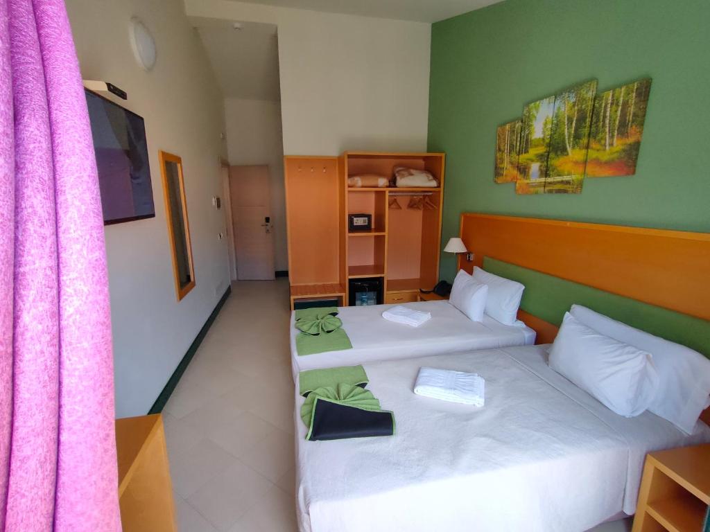Postel nebo postele na pokoji v ubytování Hotel Belvedere Mindelo, Cabo Verde