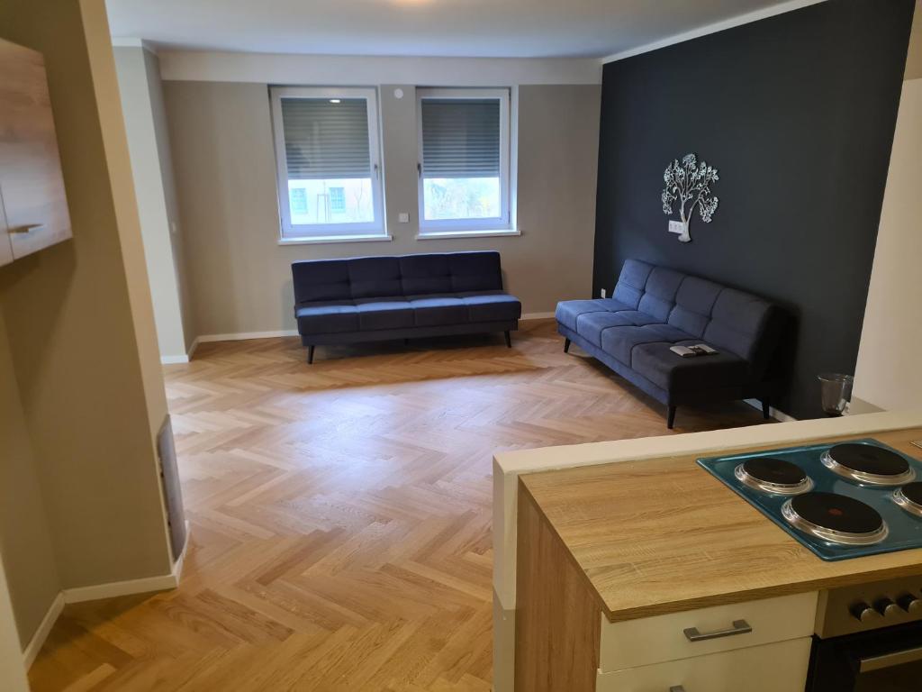 a living room with a couch and a table at GardenLoft no1 in Vienna