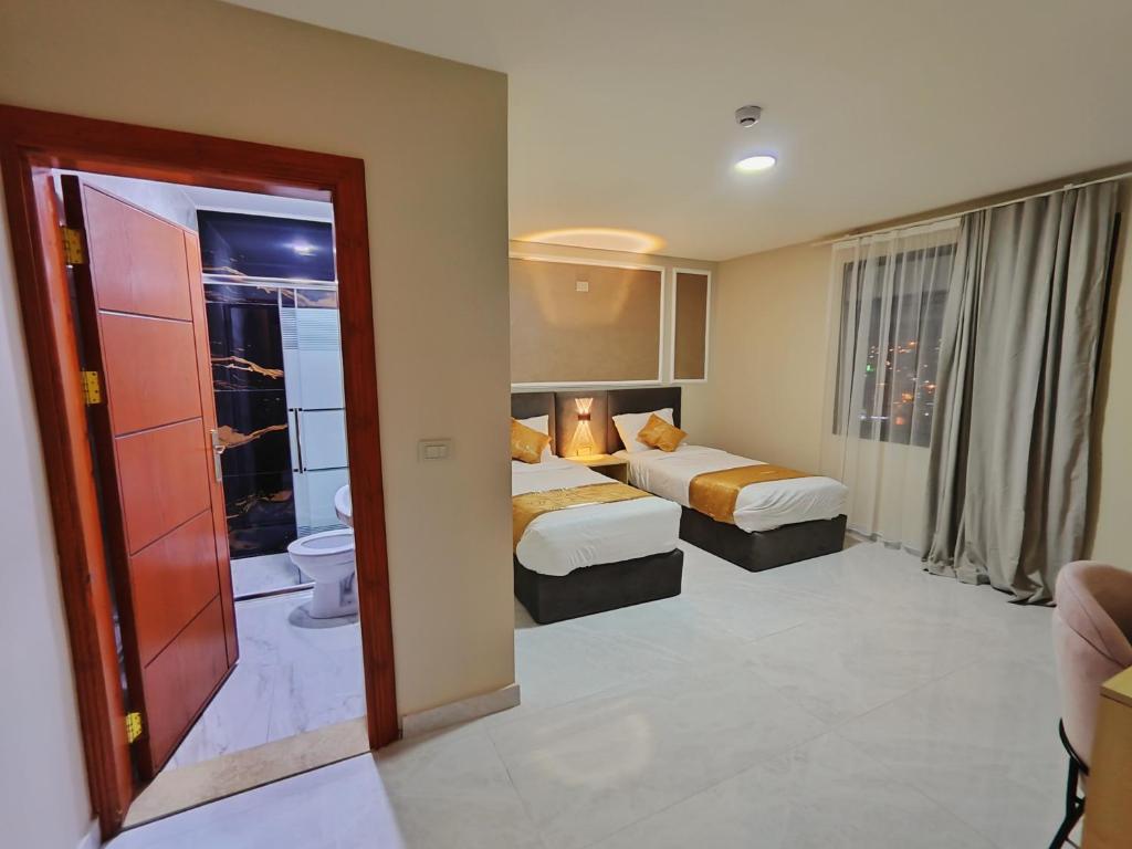 Postel nebo postele na pokoji v ubytování Rakan ApartHotel and Luxury Rooms