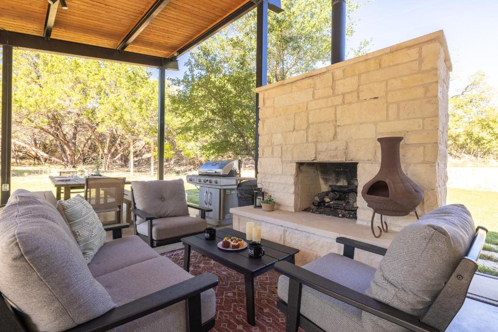 a living room with chairs and a fireplace at New Casita in Deer Creek Area in Dripping Springs