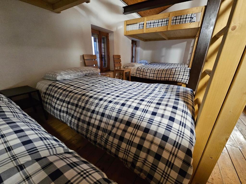 Postel nebo postele na pokoji v ubytování Rifugio Guglielmo e Giovanni Pelizzo