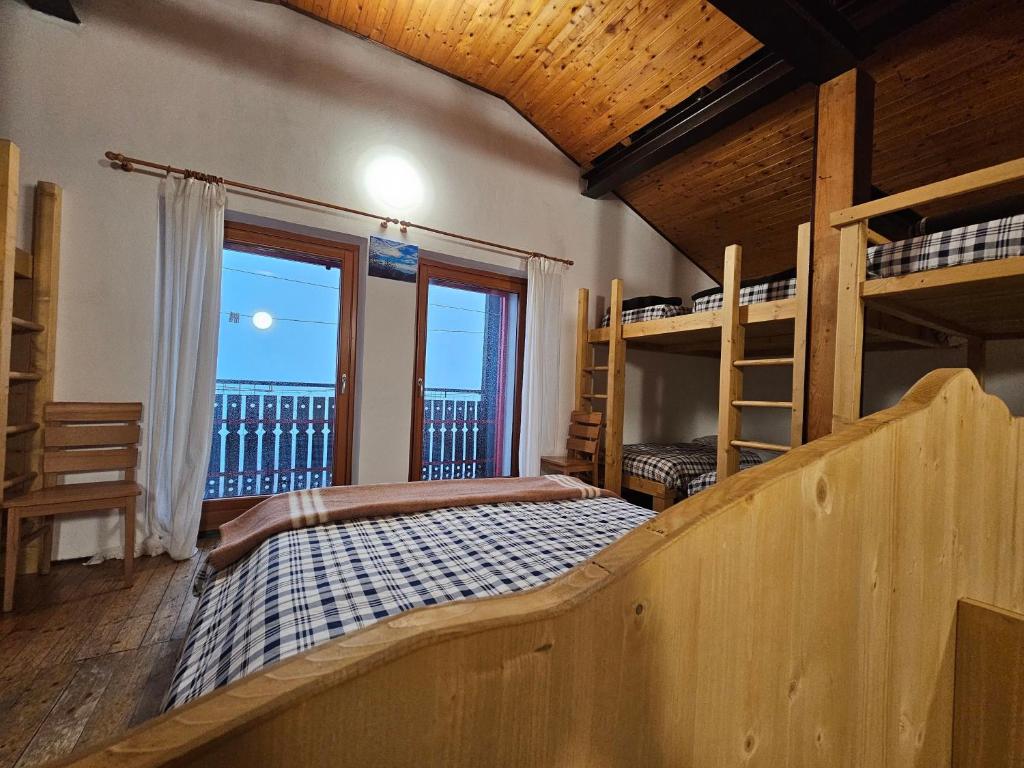 Postel nebo postele na pokoji v ubytování Rifugio Guglielmo e Giovanni Pelizzo