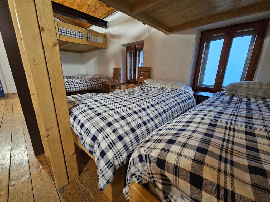 Postel nebo postele na pokoji v ubytování Rifugio Guglielmo e Giovanni Pelizzo