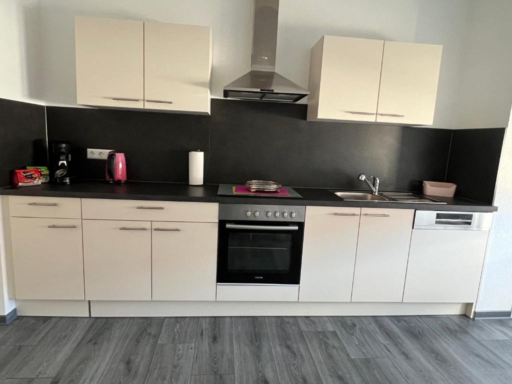 Kuchyň nebo kuchyňský kout v ubytování CityVilla Hechingen