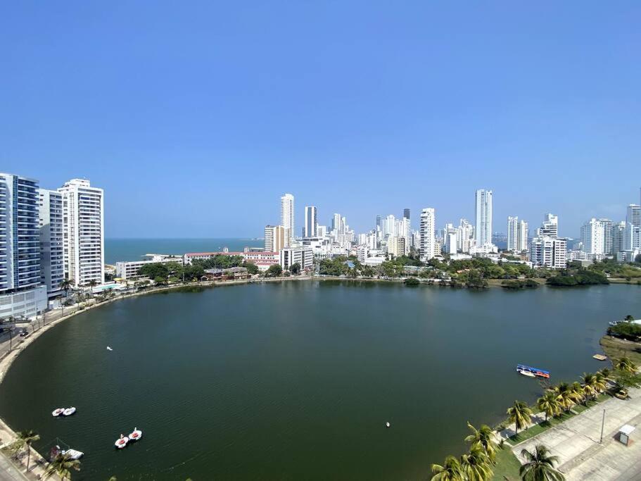 a large body of water with a city in the background at Amazing penthouse with stunning views & pool in Cartagena de Indias