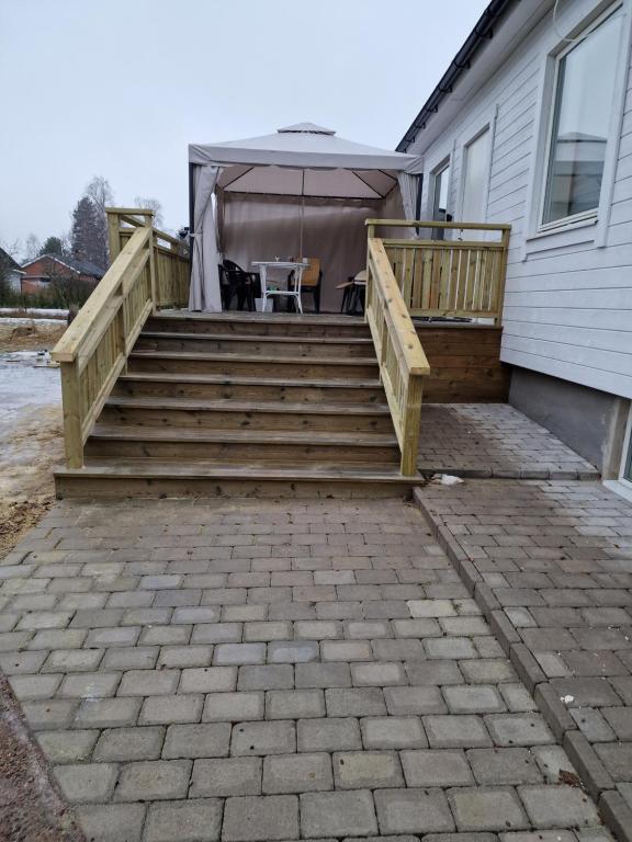 a patio with stairs leading up to a house at Avesta in Avesta